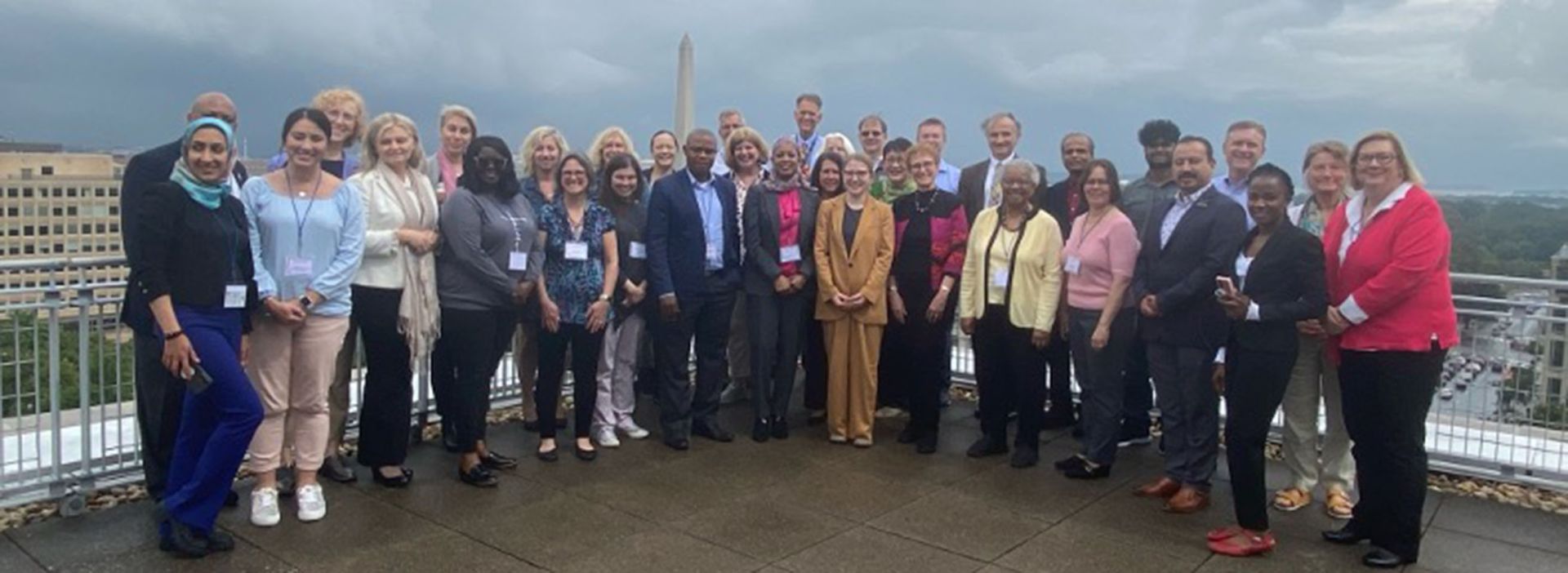 ISPEC group posed together with the National Monument in the background